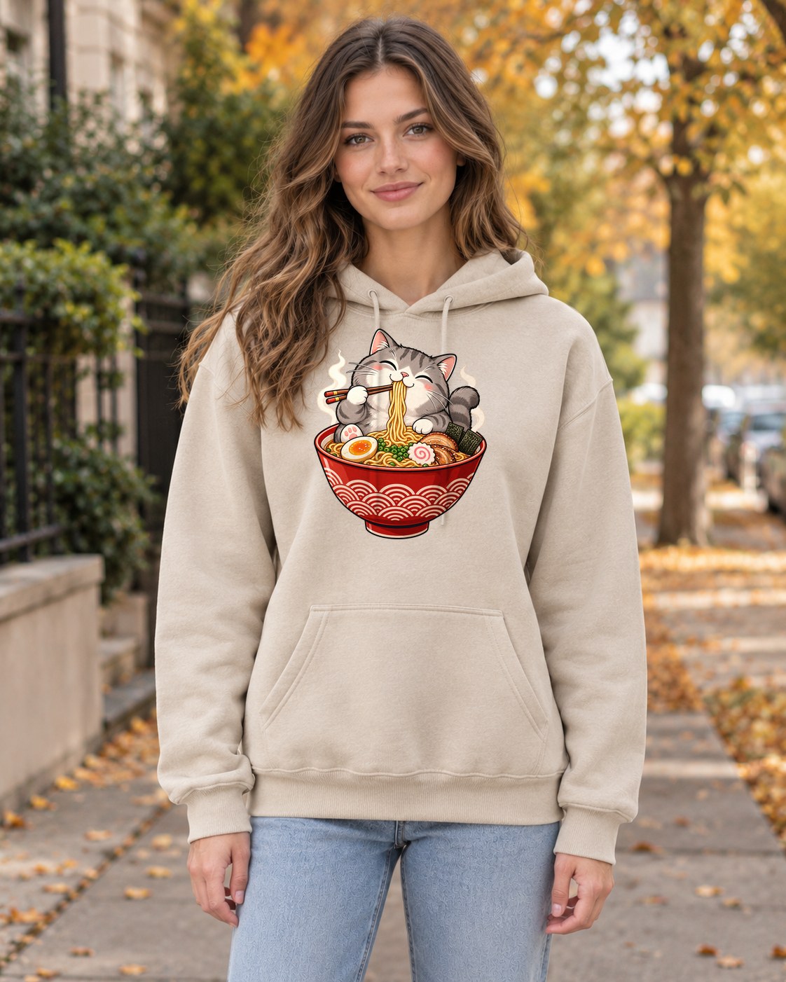 Cat Eating Ramen Hoodie in sand worn by a model