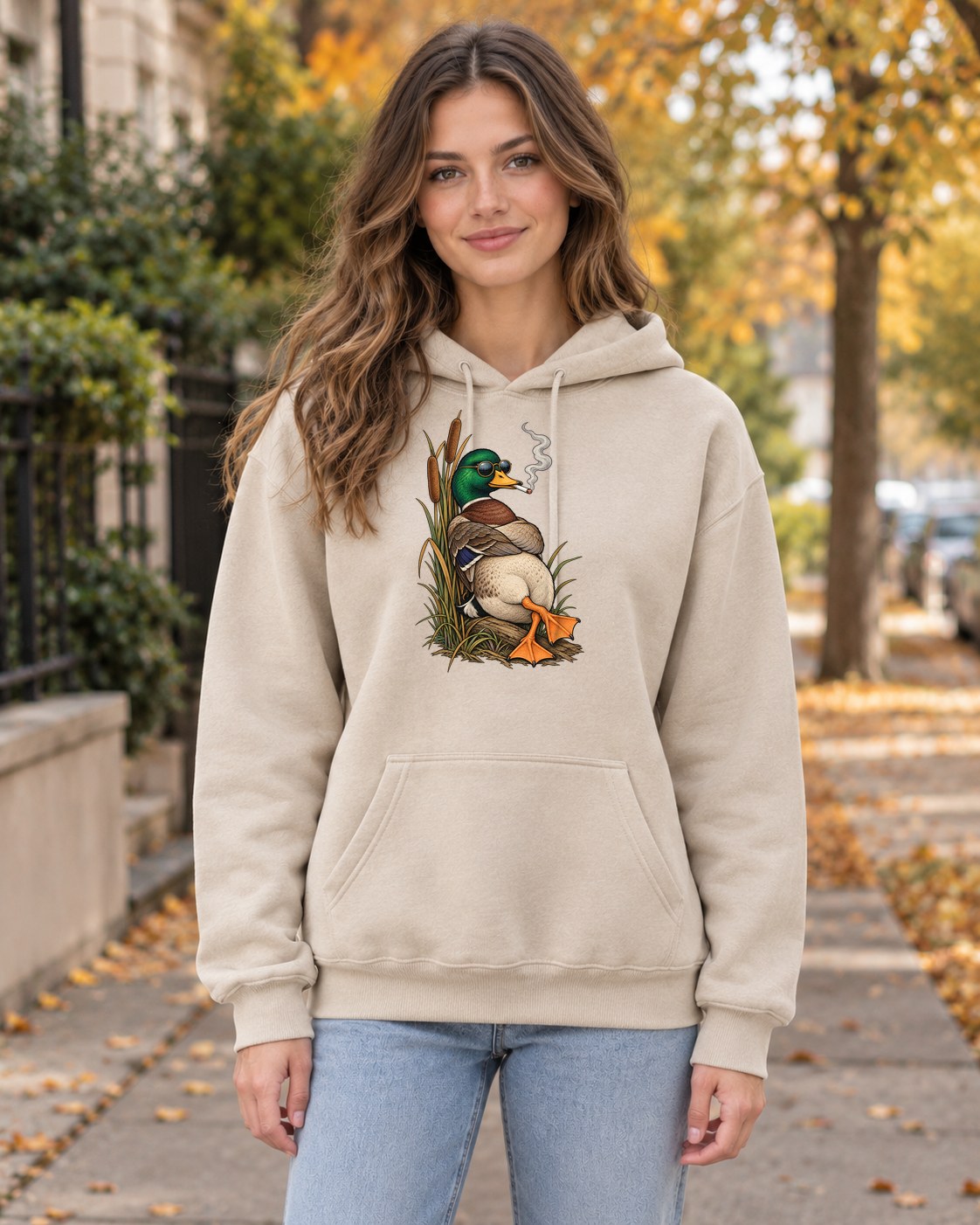 Smoking Mallard Hoodie in sand worn by a model