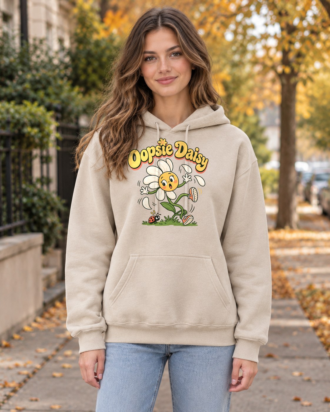 Oopsie Daisy Hoodie in sand worn by a model